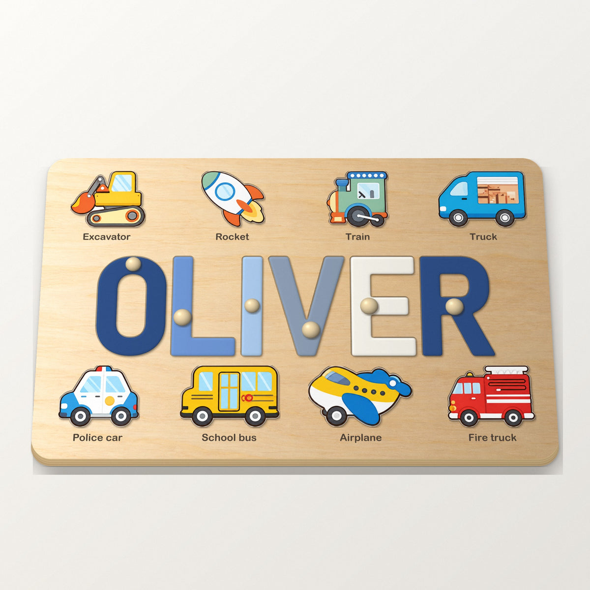 Wooden name puzzle spelling OLIVER in blue letters with eight vehicle pictures